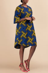 Model wearing Kitenge cotton shift dress, side view